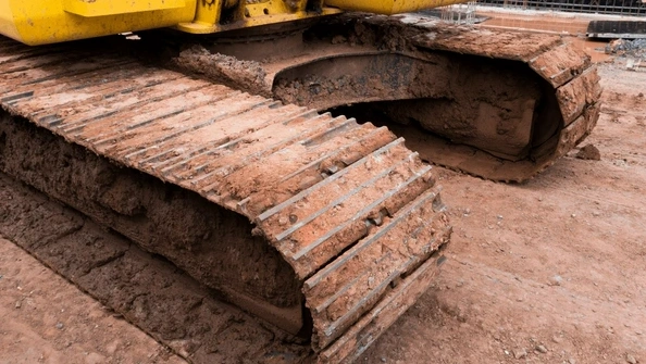 What are the causes of drilling rig track shoe damage?